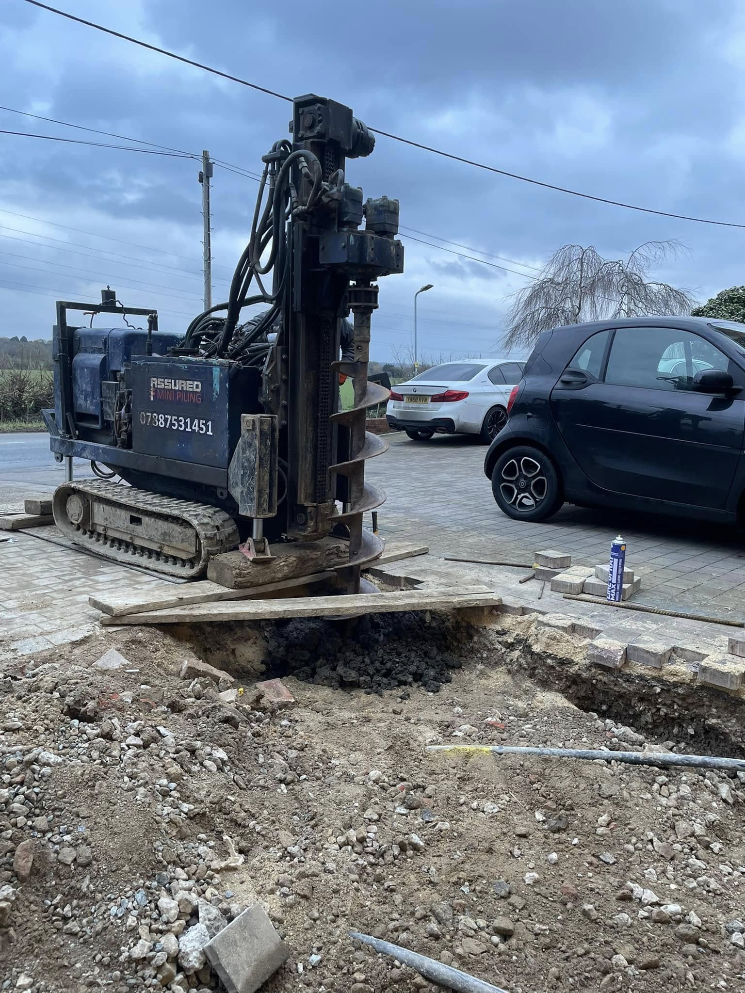 Mini piling machine in front driveway in Basildon | Essex | Kent | London | Hertfordshire