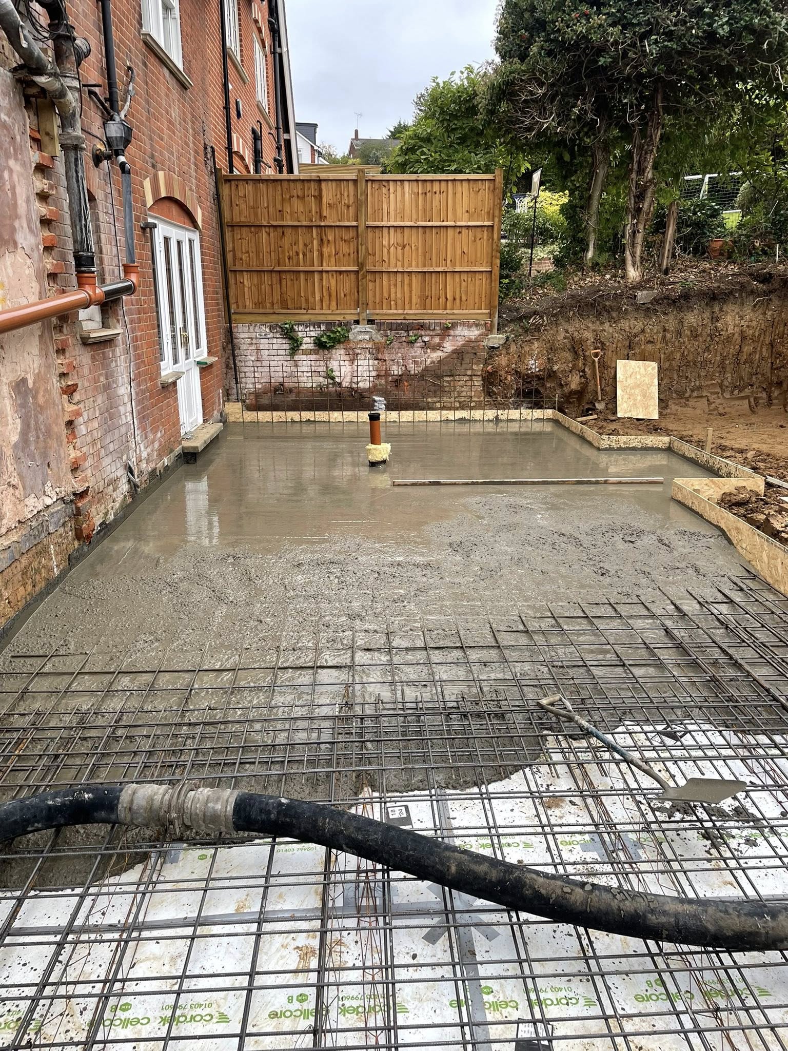 House extension foundations with concrete getting poured in Basildon | Essex | Kent | London | Hertfordshire