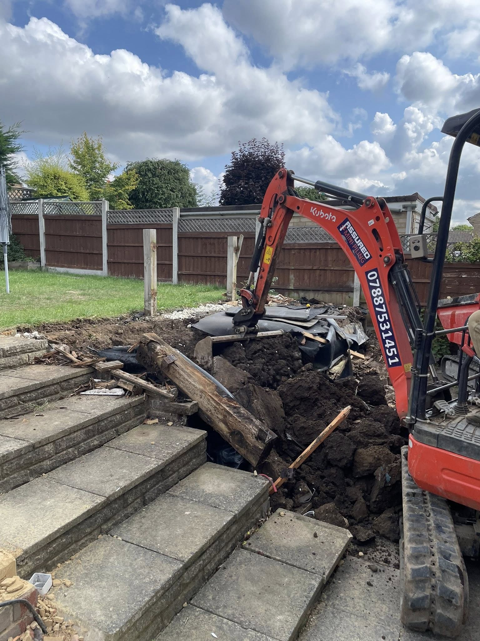 Small excavator digging up patio area in Basildon | Essex | Kent | London | Hertfordshire